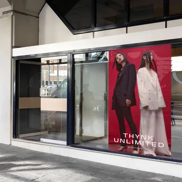 Custom mesh banner for retail storefront – large format outdoor mesh banner display
