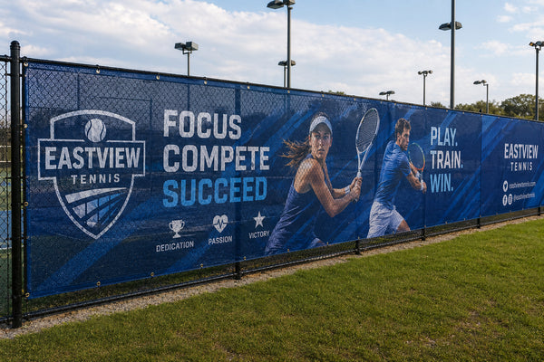 Custom outdoor mesh banner for sports event – large format mesh fence banner